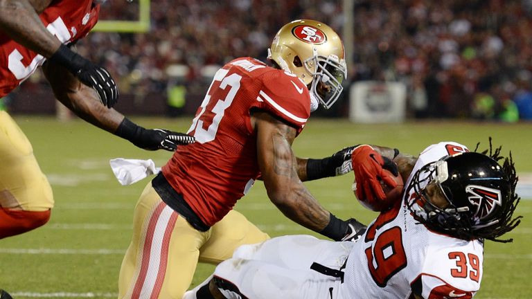 Steven Jackson 39 of the Atlanta Falcons scored a touchdown on a two yard run pushed into the endzone by NaVorro Bowman 53