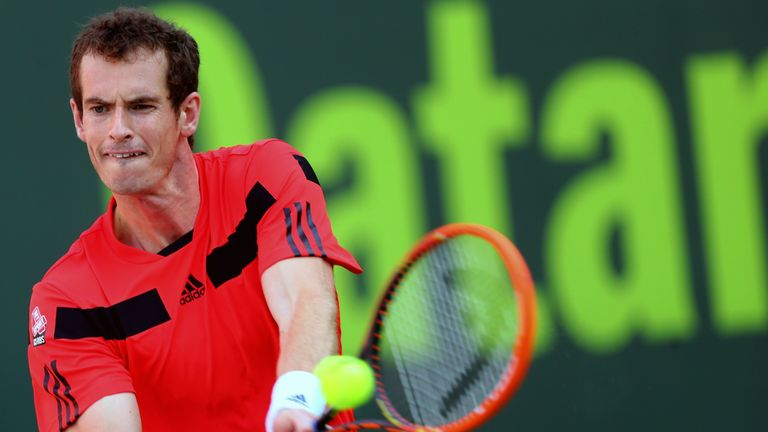 Andy Murray returns the ball to Mousa Shanan Zayed during the Qatar's ExxonMobil Open