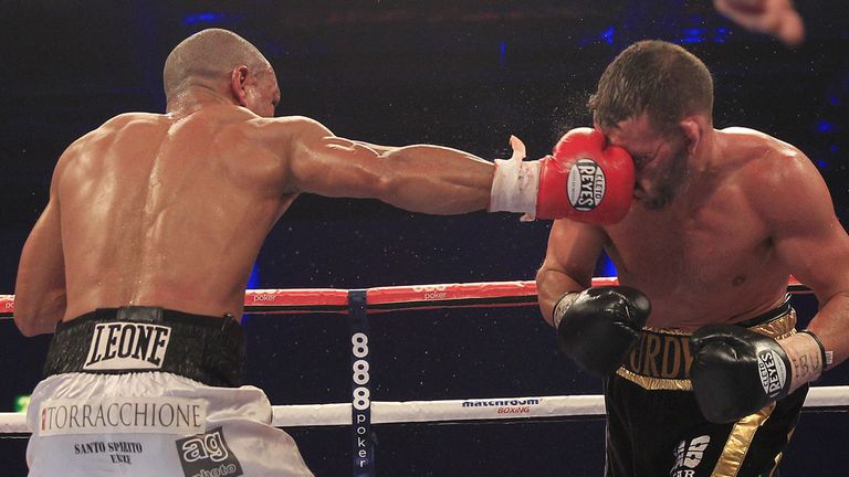 Leonard Bundu tags Lee Purdy on the way to victory (Pic Lawrence Lustig)