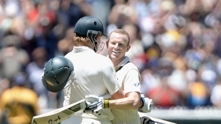 Chris Rogers of Australia celebrates with Shane Watson after reaching his century during day four of the fourth Ashes Test at the MCG