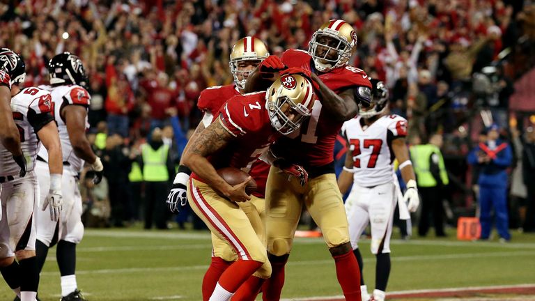 Quarterback Colin Kaepernick of the San Francisco 49ers celebrates a touchdown with wide receiver Anquan Boldin