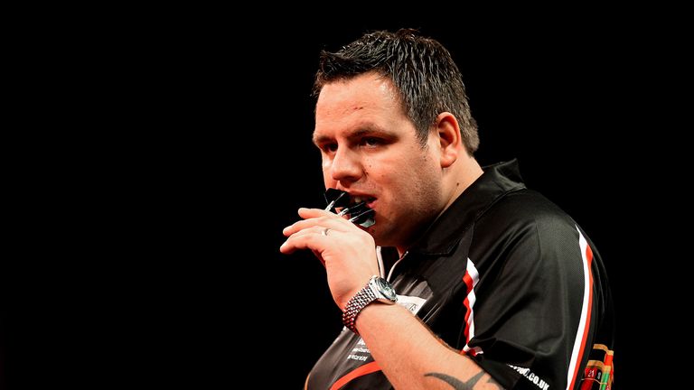 Adrian Lewis chews his dart flights during his first round match against Dennis Smith at PDC World Championship. Alexandra Palace, Dec 18 2013.