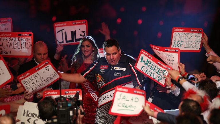 Adrian Lewis makes his way to the Alexandra Palace stage before his PDC World Championship first round match against Dennis Smith. Dec 18 2013.
