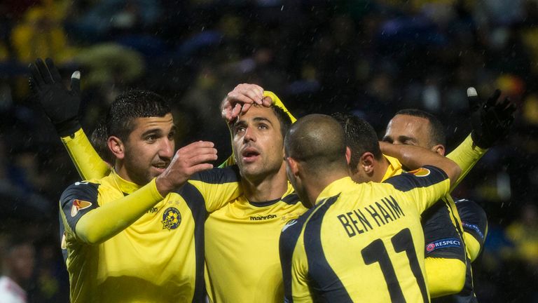 Maccabi Tel Aviv midfielder Eran Zahavi (C) celebrates after scoring his teams first goal during their UEFA Europa League Group F qualifying football match