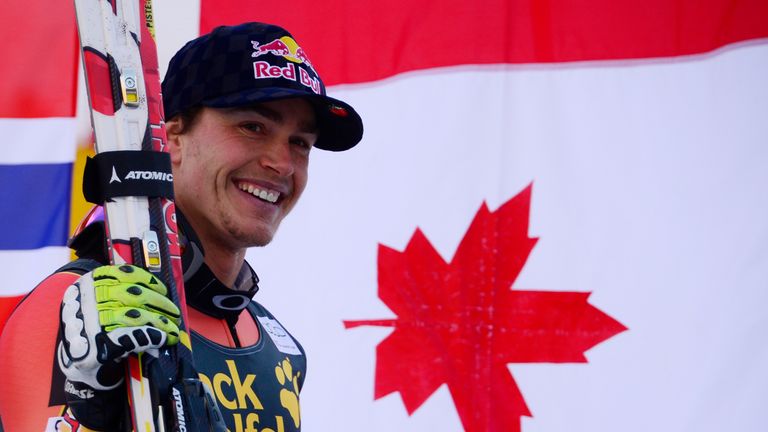 Canada's Erik Guay celebrates on the podium after winning the World Cup Men's Downhill in Val Gardena