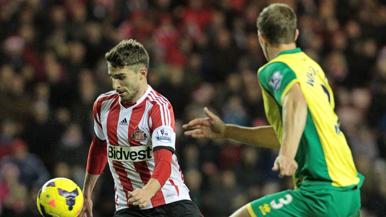 Sunderland's Italian striker Fabio Borini (L) challenges Norwich City's Scottish defender Steven Whittaker during the English Premier League football match