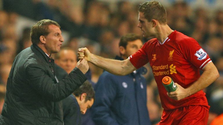 Manager Brendan Rodgers of Liverpool congratulates Jordan Henderson  on scoring a goal.