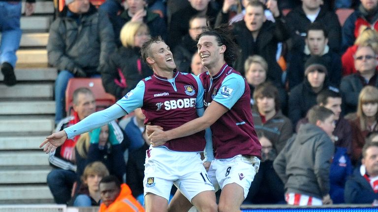 West Ham United's Jack Collison celebrates scoring their opening goal with Andy Carroll during the Barclays Premier League match at the Britannia Stadium, 