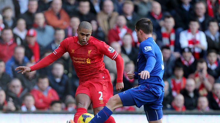 Liverpool's Glen Johnson (left) and Cardiff City's Andrew Taylor battle for the ball