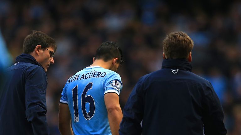 Sergio Aguero of Manchester City receives treatment during the Barclays Premier League match between Manchester City and Arsenal