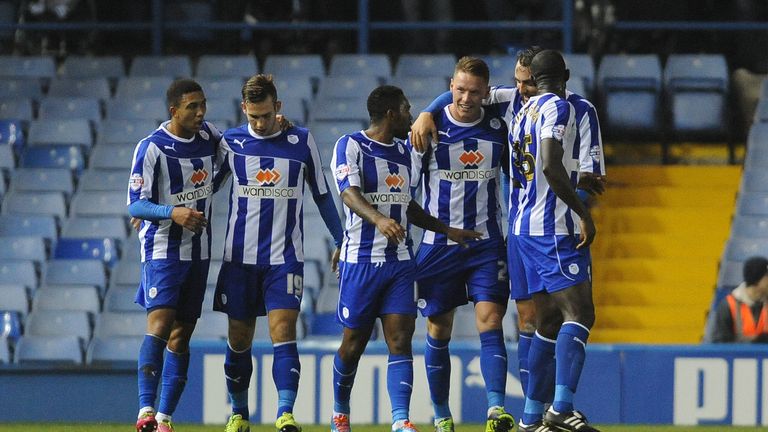 Sheffield Wednesday's Connor Wickham (second from the right, facing) celebrates with his team-mates after scoring his side's second goal against Leicester