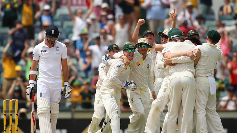 Australian players celebrate dismissing James Anderson of England to claim a 3-0 series win on day five of the third Ashes Test. Dec 17 2013.