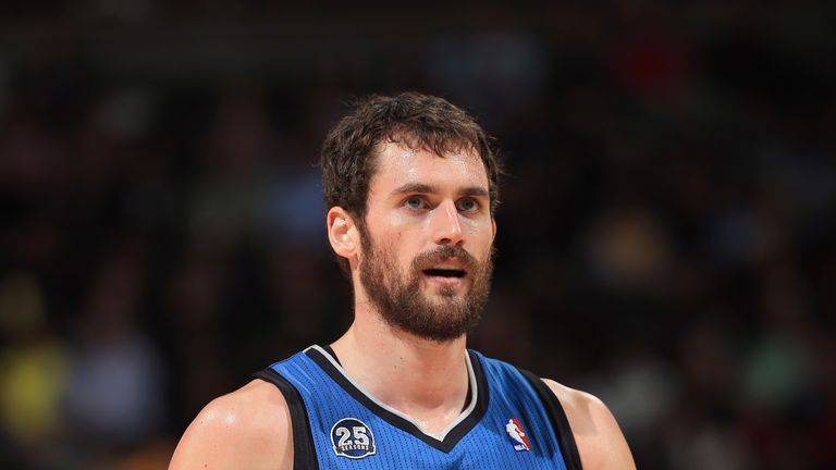 Kevin Love #42 of the Minnesota Timberwolves heads upcourt against the Denver Nuggets at Pepsi Center on November 15, 2013 