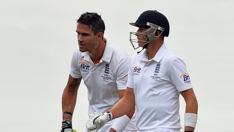 England's batting pair Kevin Pietersen and Joe Root walk back for drinks during day four of the second Ashes Test at Adelaide