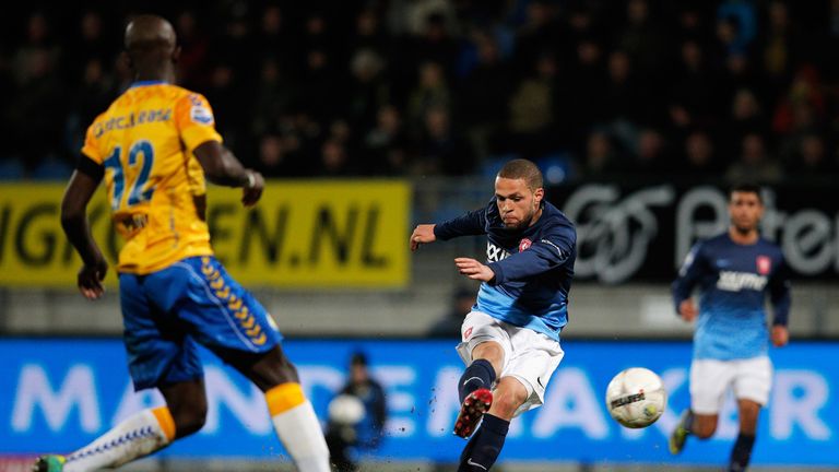 WAALWIJK, NETHERLANDS - DECEMBER 20:  Luc Castaignos of RKC shoots and scores his teams first goal during the Eredivisie match between RKC Waalwijk and FC 