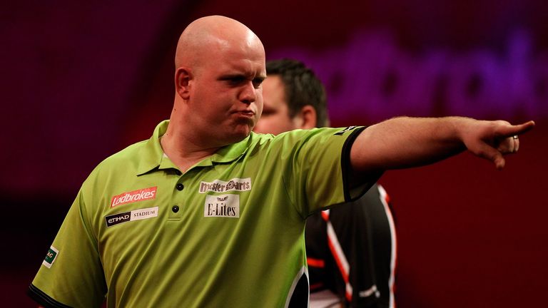 Michael van Gerwen celebrates winning the fourth set during his semi-final match against Adrian Lewis at the PDC World Darts Championship 