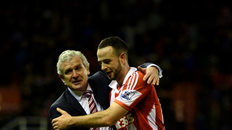 STOKE ON TRENT, ENGLAND - DECEMBER 07:  Mark Hughes the Stoke manager and Marc Wilson of Stoke celebrate following their team's 3-2 victory during the Barc