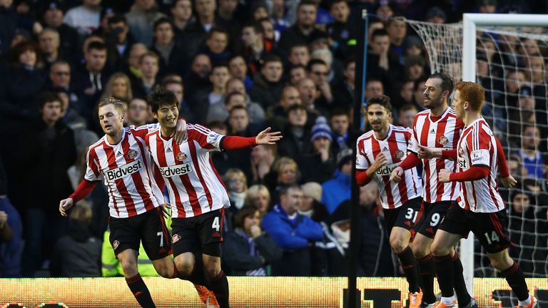 LIVERPOOL, ENGLAND - DECEMBER 26:  Ki Sung-Yong #4 (2nd L) of Sunderland celebrates after scoring the opening goal from the penalty spot during the Barclay