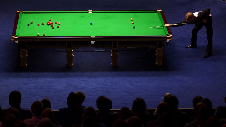 Barry Hawkins of England in action against Ronnie O'Sullivan of England during the final of the Betfair World Snooker Championship at the Crucible Theatre