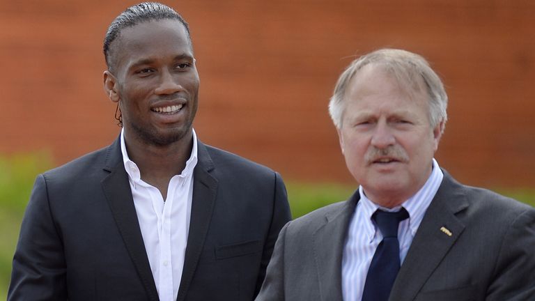 Football player Didier Drogba (L) and secretary general of FIFPro Theo van Seggelen arrive for the opening of the new building of FIFPro