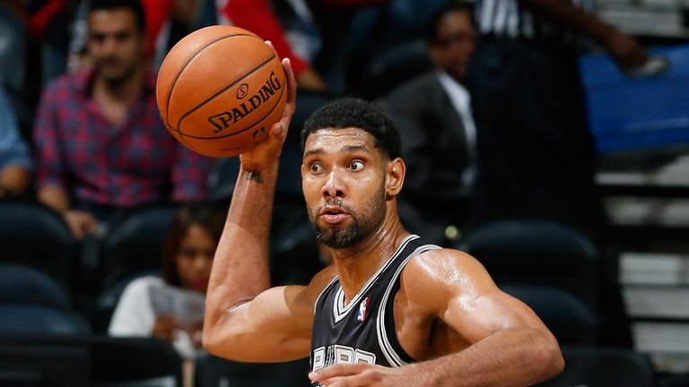 Tim Duncan #21 of the San Antonio Spurs looks to pass against the Atlanta Hawks at Philips Arena on October 17, 2013 in Atlanta, Georgia.  NOTE TO USER: User expressly acknowledges and agrees that, by downloading and or using this photograph, User is consenting to the terms and conditions of the Getty Images License Agreement