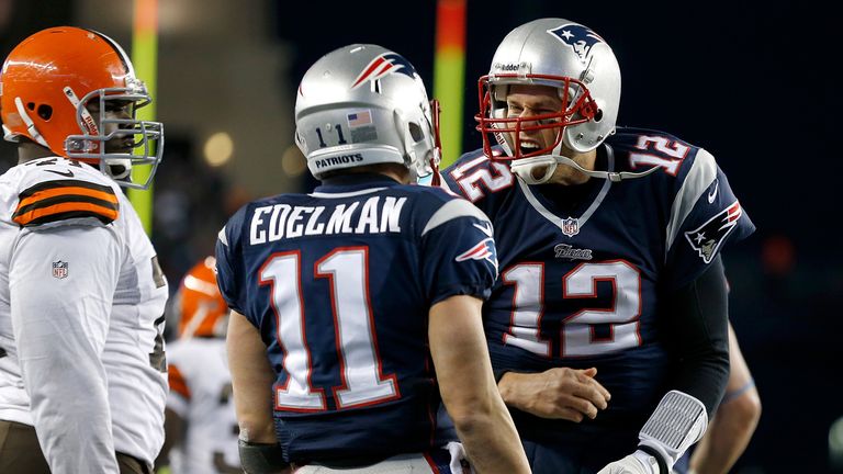 Tom Brady #12 of the New England Patriots celebrates a game-winning touchdown with Julian Edelman