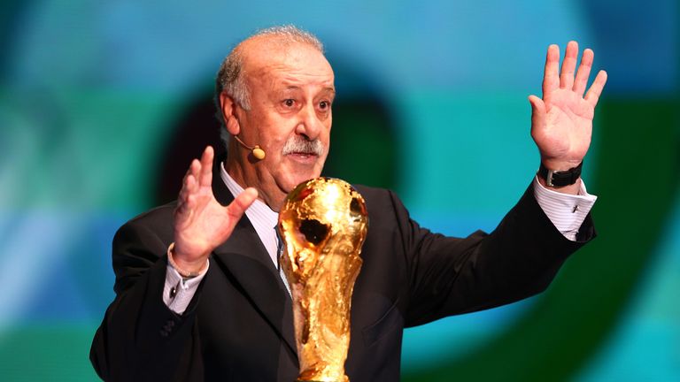 COSTA DO SAUIPE, BRAZIL - DECEMBER 06:  Spain coach Vicente del Bosque speaks to the audience behind the World Cup trophy before the Final Draw for the 201