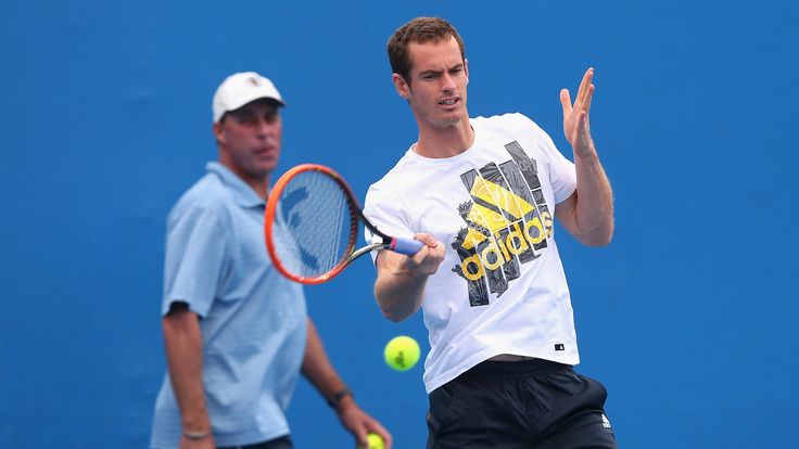 Andy Murray of Great Britain plays a forehand whilst his coach Ivan Lendl watches on during practice ahead of the 2014 Australian Open.