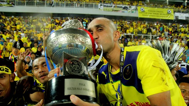 Zesh Rehman with Charity Shield trophy on debut for Malaysian club Pahang