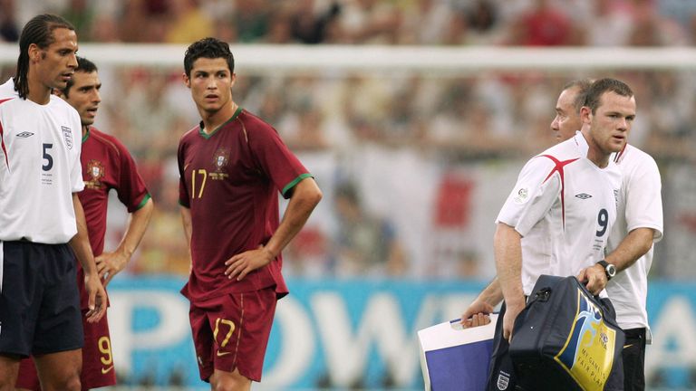 Ronaldo looks on as Manchester United team-mate Wayne Rooney is sent off during a World Cup game between England and Portugal July 2006