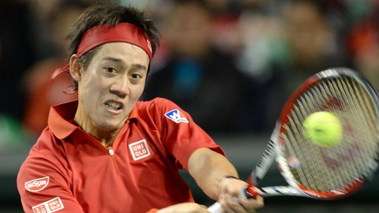 - Nishikori of Japan returns a shot to Peter Polansky of Canada during their singles match of the Davis Cup World Group First Round in Tokyo