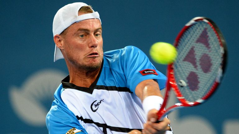 Lleyton Hewitt of Australia hits a backhand return in his match against Feliciano Lopez at the Brisbane International