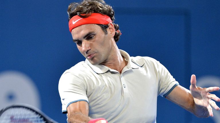 - Roger Federer of Switzerland plays a forehand in his match against Jarkko Nieminen of Finland during day four of the 2014 Brisbane International