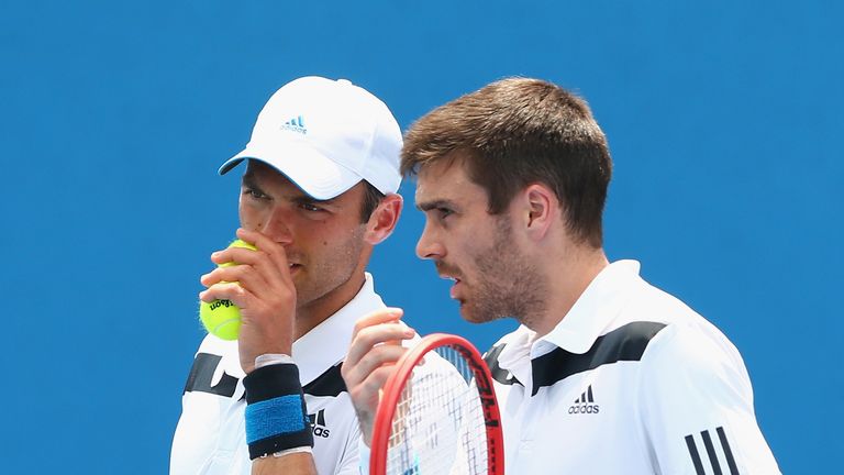 Ross Hutchins (left) talks tactics with Colin Fleming