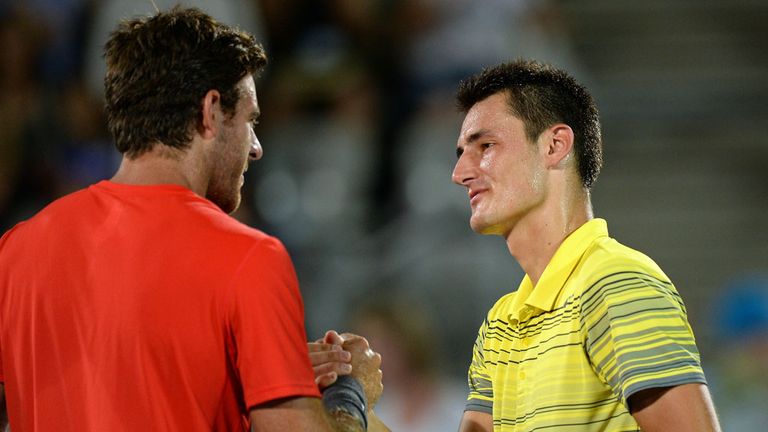 Juan Martin del Potro (l) shakes hands with Bernard Tomic following their one-sided Sydney final on Saturday