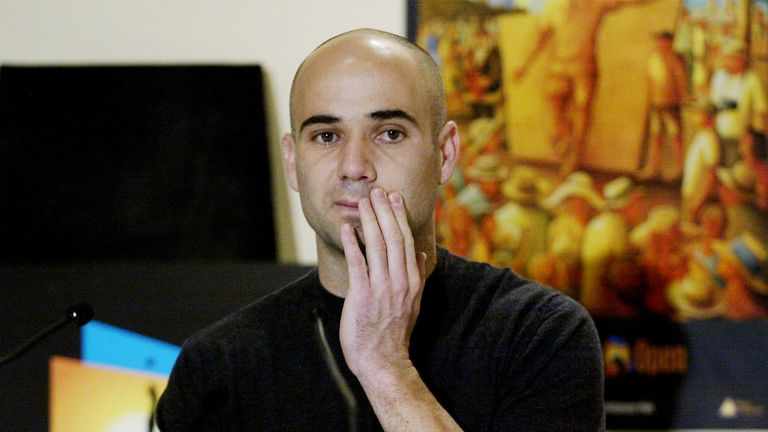 Andre Agassi of the USA speaks during a press conference after withdrawing from the 2002 Australian Open