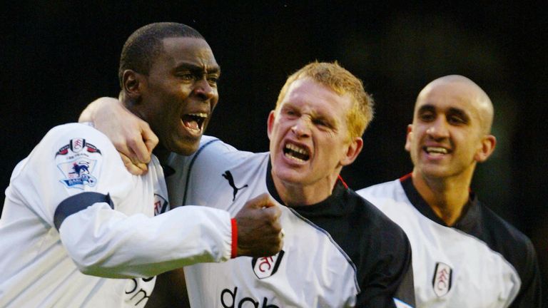 Fulham's Andy Cole celebrates scoring with teammates Mark Pembridge and Zesh Rehman in 2005.