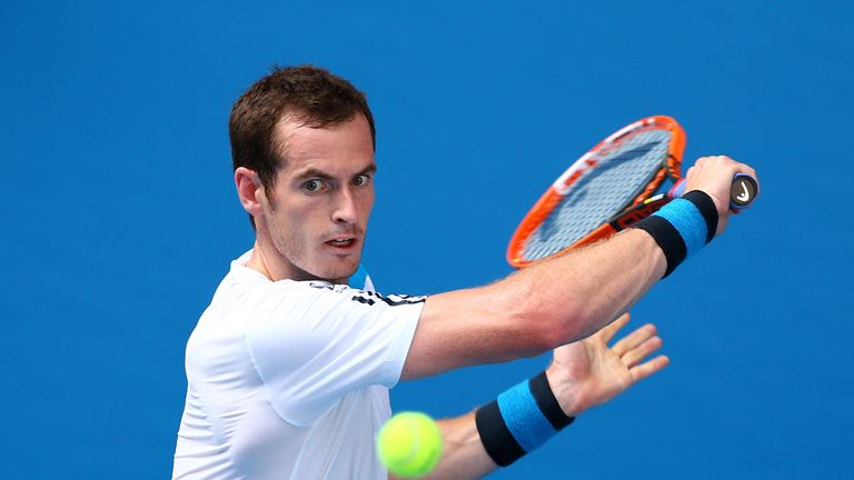Andy Murray of Great Britain plays a backhand in his first round match against Go Soeda of Japan during day two of the Australian Open