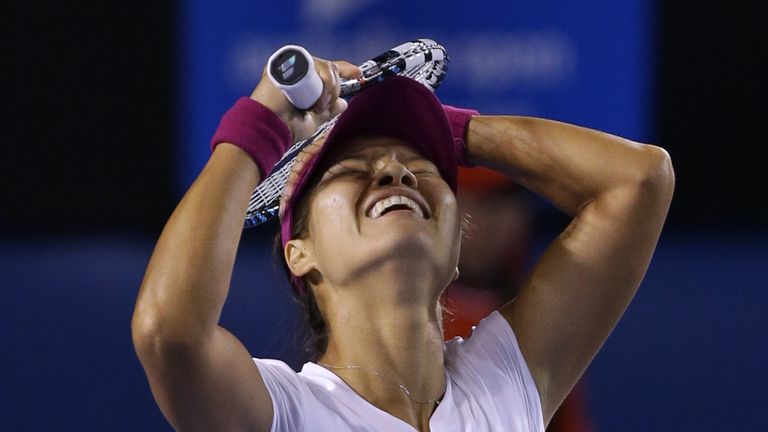 Li Na of China celebrates after defeating Dominika Cibulkova of Slovakia in their women's singles final at the Australian Open