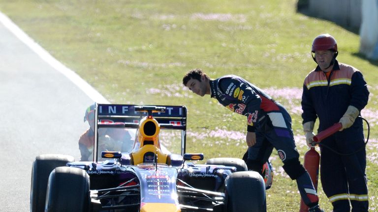 Smoke comes from the broken down Red Bull of Daniel Ricciardo