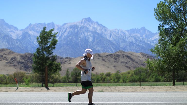 Mount Whitney is seen in the distance as David Ploskonka competes in the Badwater Ultramarathon