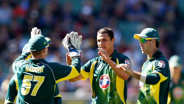 Brad Haddin, Nathan Coulter-Nile and Glenn Maxwell of Australia celebrate the wicket of Ravi Bopara of England during the first one-dayer in Melbourne