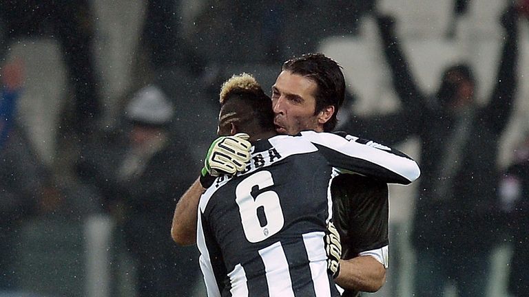 Juventus' French midfielder Paul Pogba (C) celebrates with goalkeeper Gianluigi Buffon after scoring against Udinese during their Serie A football match in