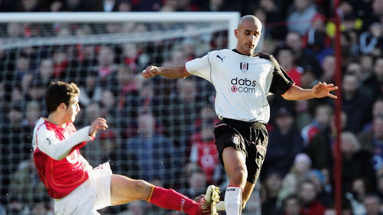 Cesc Fabregas of Arsenal tackles Zesh Rehman of Fulham in 2004.