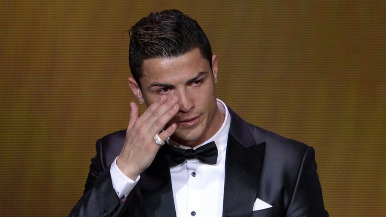 Real Madrid's Portuguese forward Cristiano Ronaldo cries after receiving the 2013 FIFA Ballon d'Or award for player of the year during the FIFA Ballon d'Or