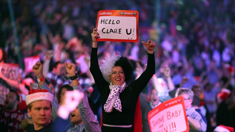 Darts fans enjoy the atmosphere during the World Darts Championship on Day One at Alexandra Palace