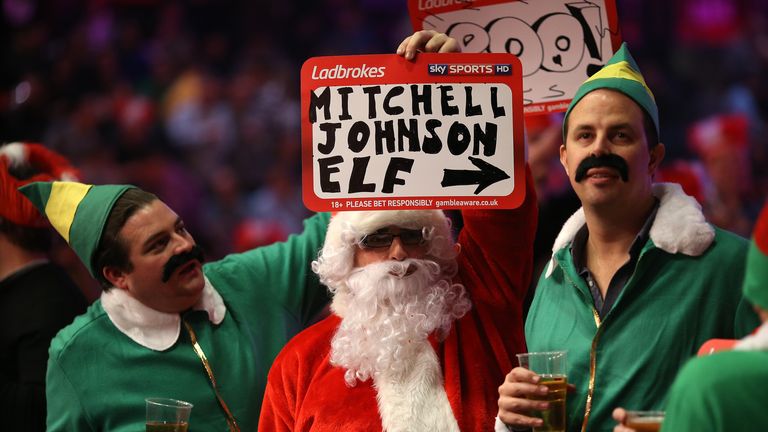 Darts fans in festive fancy dress during the World Darts Championship on Day Eight at Alexandra Palace