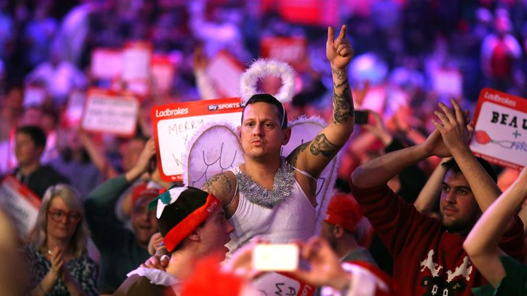  A darts fan dressed as an angel enjoys the darts during World Darts Championship on Day Nine at Alexandra Palace