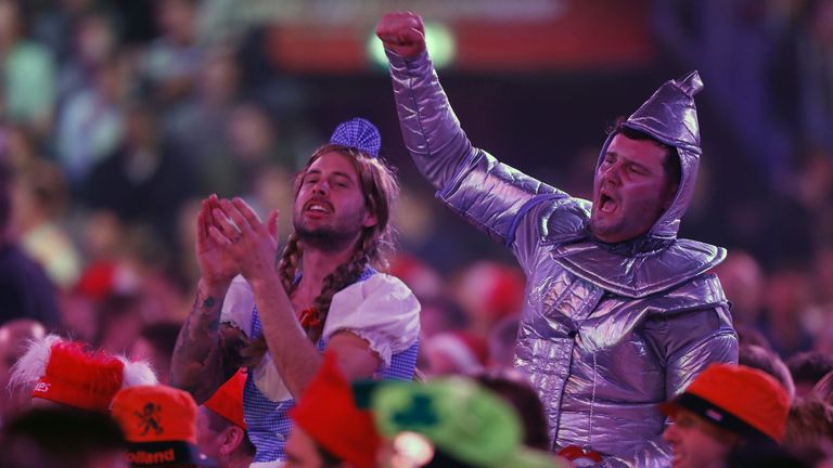 Fans dance in the crowd on day thirteen of the World Darts Championship at Alexandra Palace