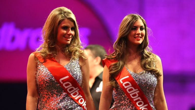 Walk-on girls on stage during the World Darts Championship on Day Two at Alexandra Palace